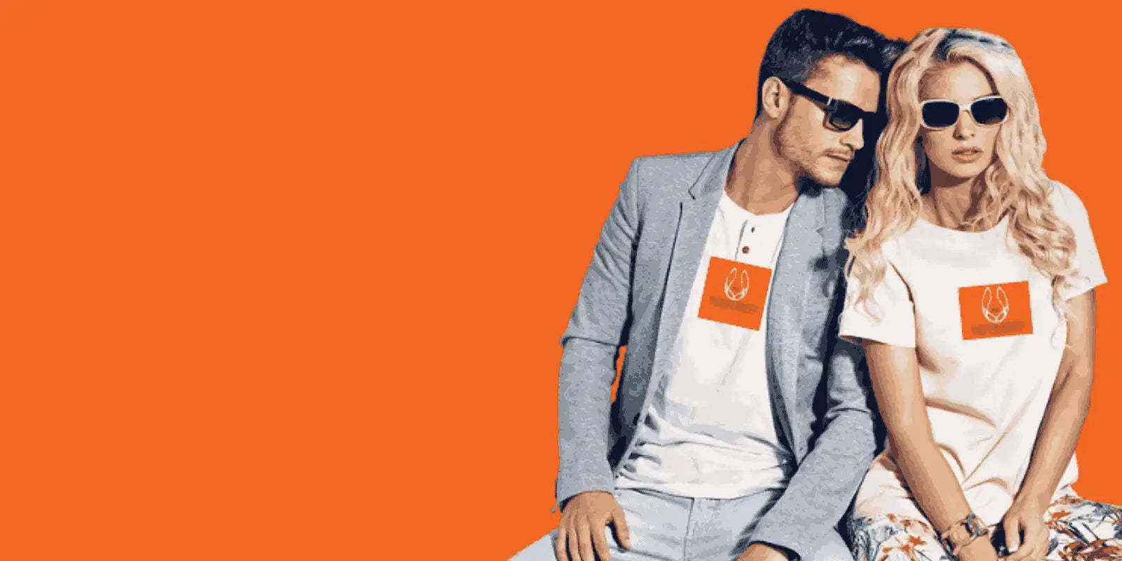 Two people wearing matching t-shirts with a logo on an orange background