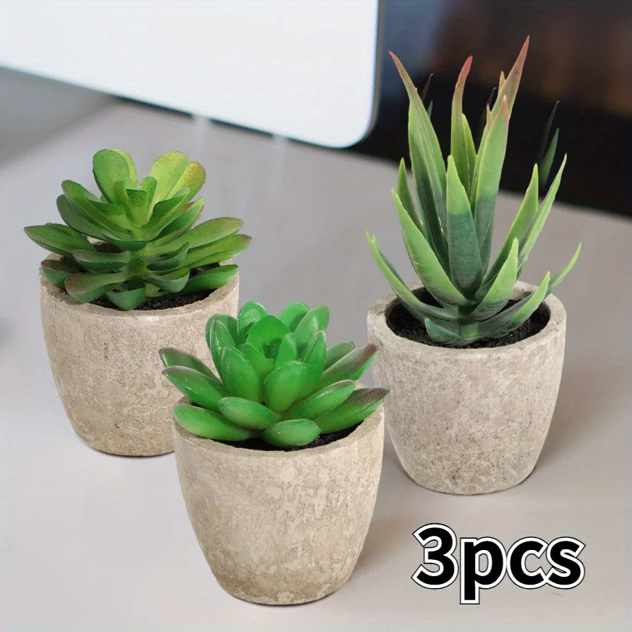 Three-piece artificial succulent planter indoor set in gray ceramic pots angled view