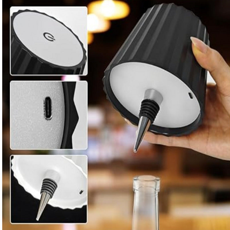 Bottom view of black wine bottle cap desk lamp showing plastic lamp holder and USB connection